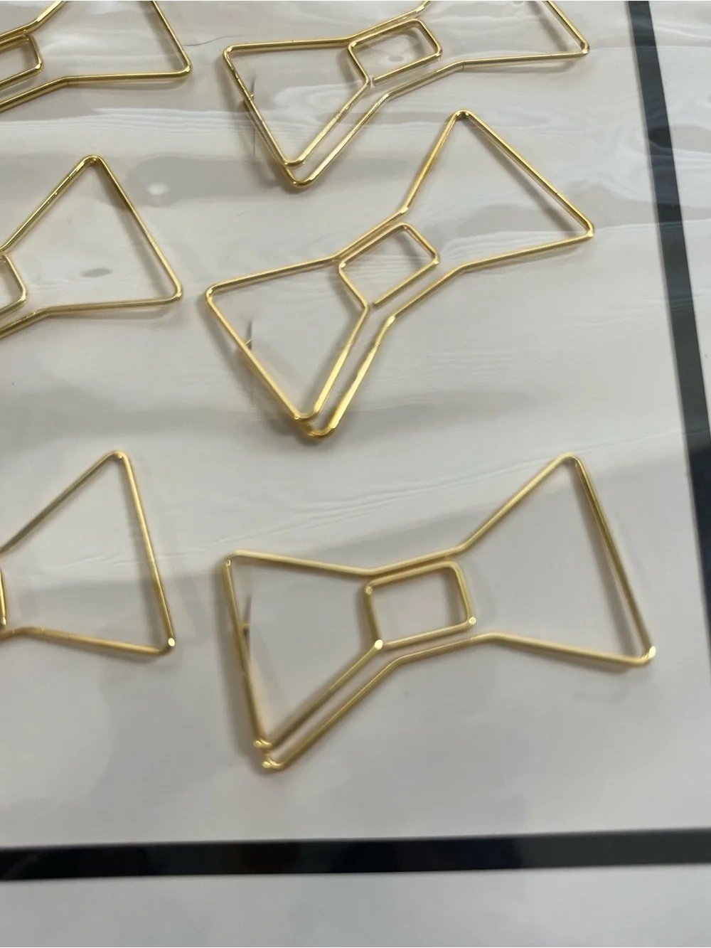 kate spade gold bow paper clips - 12 per package.